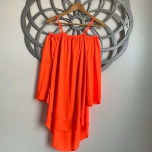 You won’t be missed wearing this neon orange GB high low dress!
